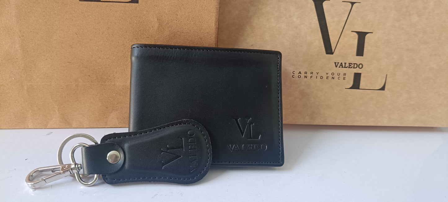 Black leather wallet and keychain set with Valedo branding on a white surface.